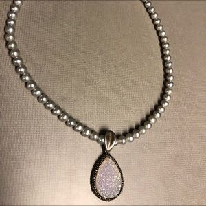 Grey pearl necklace.